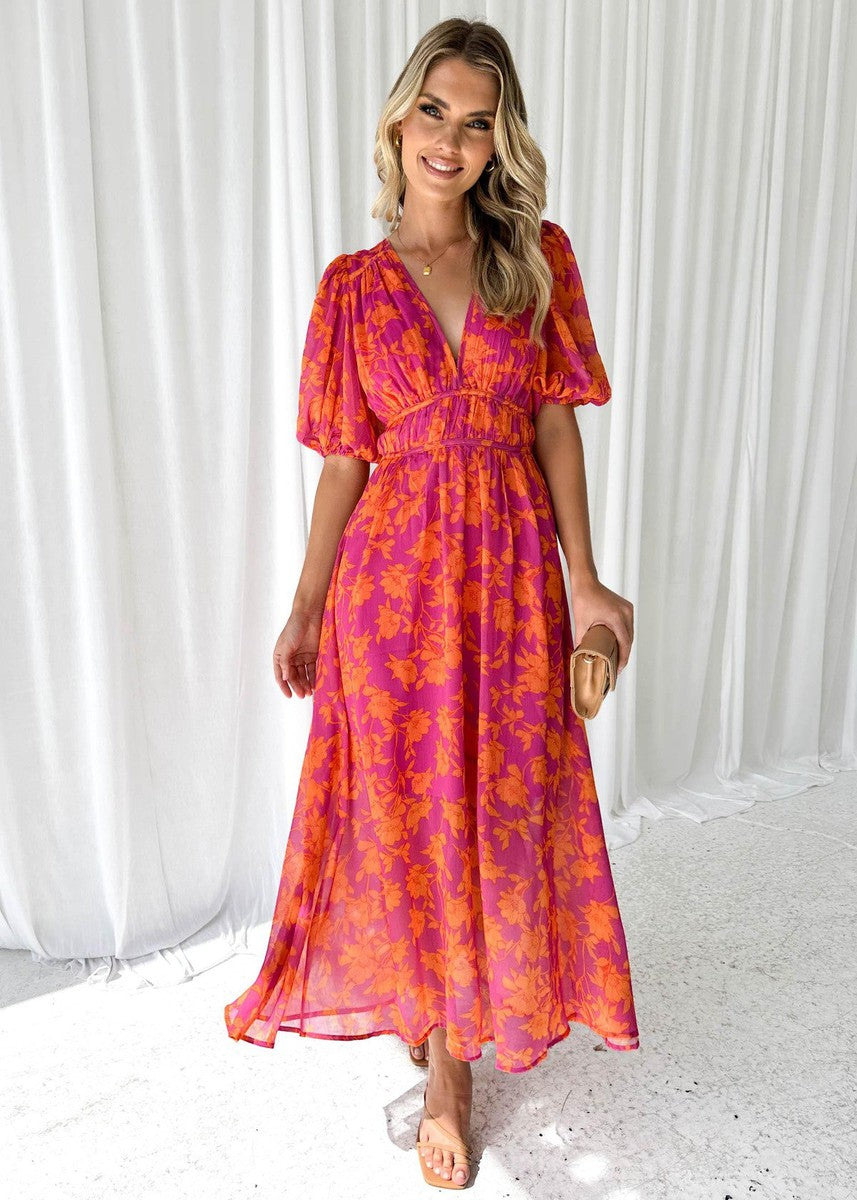 Pink-orange floral midi dress with puff sleeves and V-neck, flowing skirt
