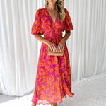 Pink-orange floral midi dress with puff sleeves and V-neck, cinched waist