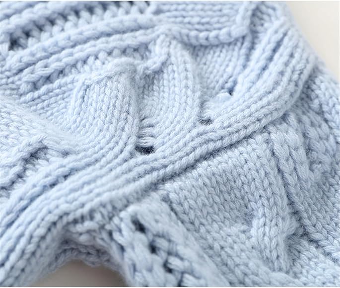 Light blue cable-knit pullover with high neck and textured stitch detail