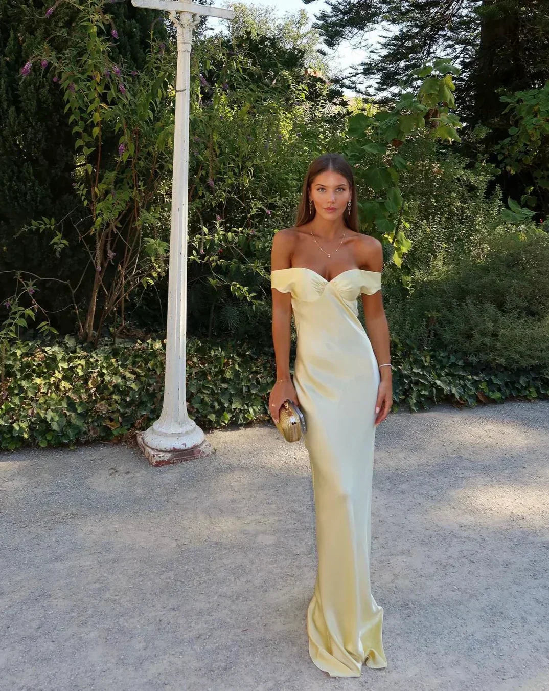 Light gold strapless satin evening dress with sweetheart neckline and fitted column silhouette