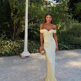 Light gold strapless satin evening dress with sweetheart neckline and fitted column silhouette