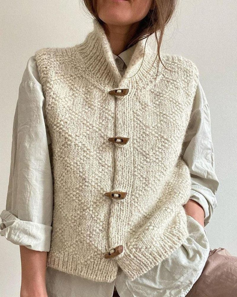 Cream chunky knit sleeveless cardigan vest with dark wood-look buttons and collar