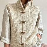 Cream chunky knit sleeveless cardigan vest with dark wood-look buttons and collar