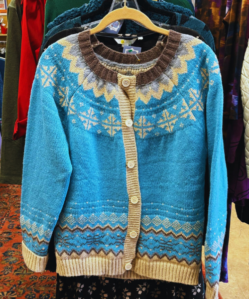 Blue knit pullover with geometric yoke, button-front placket, ribbed cuffs and hem