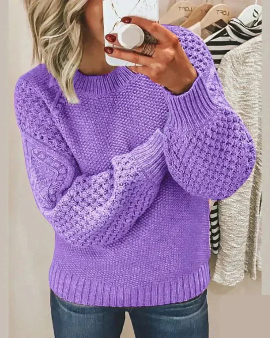 Purple chunky knit pullover with long sleeves and crew neck, textured stitch detail