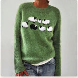 Green knit sweater with sheep intarsia on crew neck, long sleeves