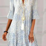Boho-style V-neck patterned dress, light blue and white, button front, flared skirt
