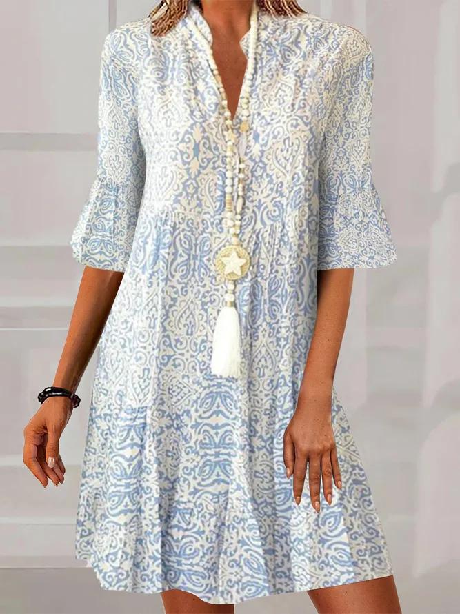 Boho-style V-neck patterned dress, light blue and white, button front, flared skirt