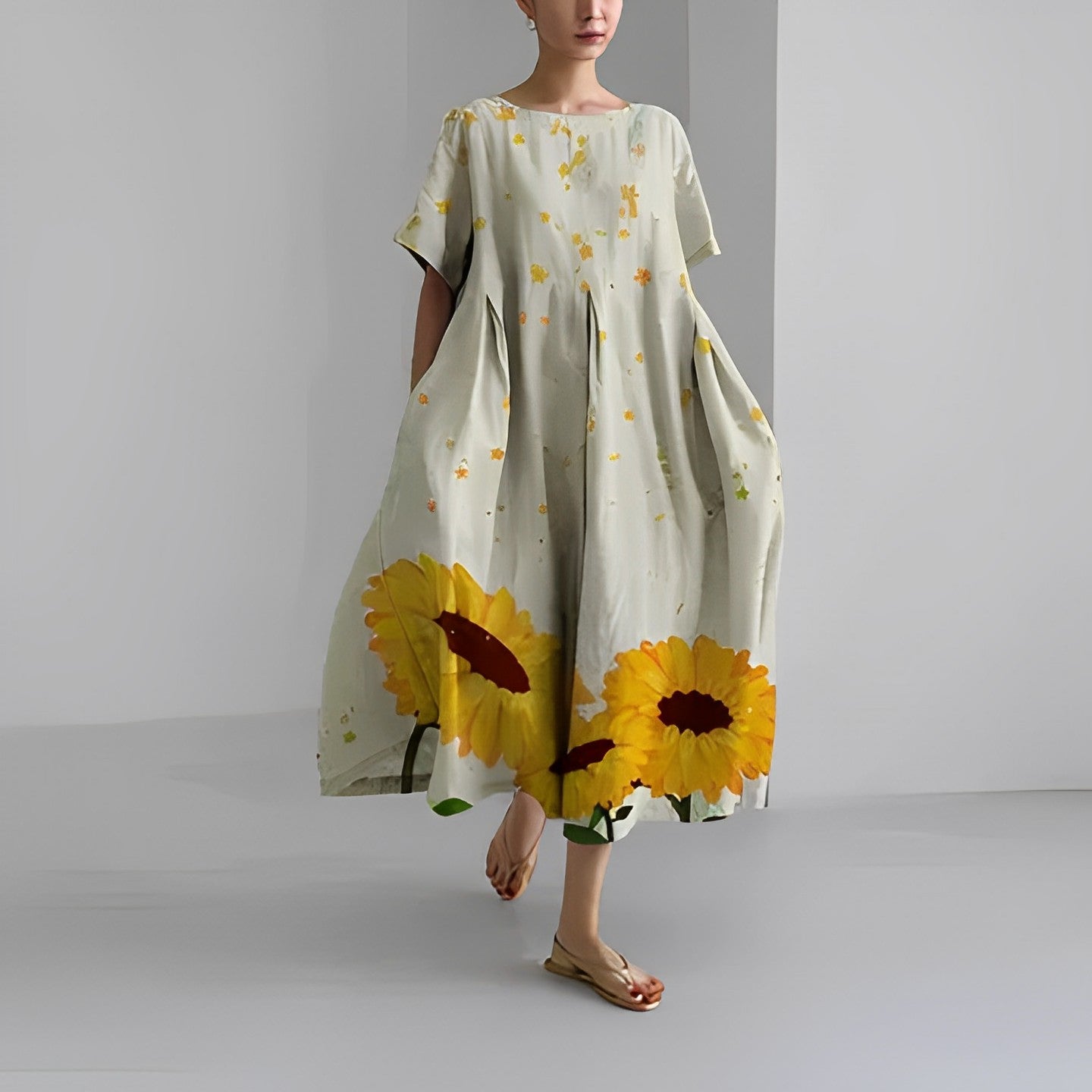 Women's floral dress, cream base with yellow sunflower print, midi length with short sleeves