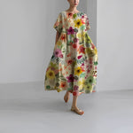 Women's floral dress, light beige base with colorful garden flower print, midi length