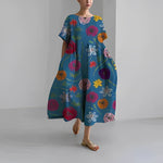 Women's floral dress, dark blue base with colorful floral and bug print, midi length