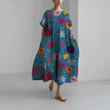 Women's floral dress, dark blue base with colorful floral and bug print, midi length