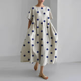 Women's floral dress, white base with navy polka dots print, midi length, short sleeves