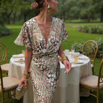 Midi wrap dress, V-neck and gathered waist, light green and pink abstract print