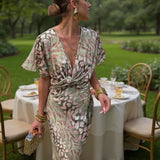 Midi wrap dress, V-neck and gathered waist, light green and pink abstract print
