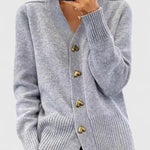 Light gray cardigan with V-neck, long sleeves, ribbed cuffs and hem, gold button placket