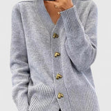 Light gray cardigan with V-neck, long sleeves, ribbed cuffs and hem, gold button placket