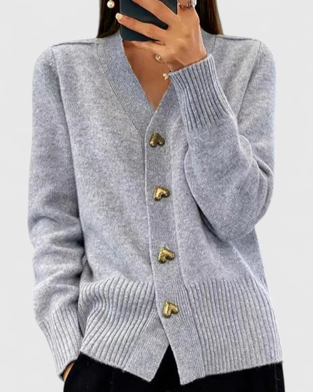 Light gray cardigan with V-neck, long sleeves, ribbed cuffs and hem, gold button placket