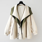 Windproof weatherproof jacket in cream with olive-green trim, hooded front and snap closures