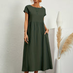 Dark green midi casual dress with short sleeves and gathered waist, loose flared skirt