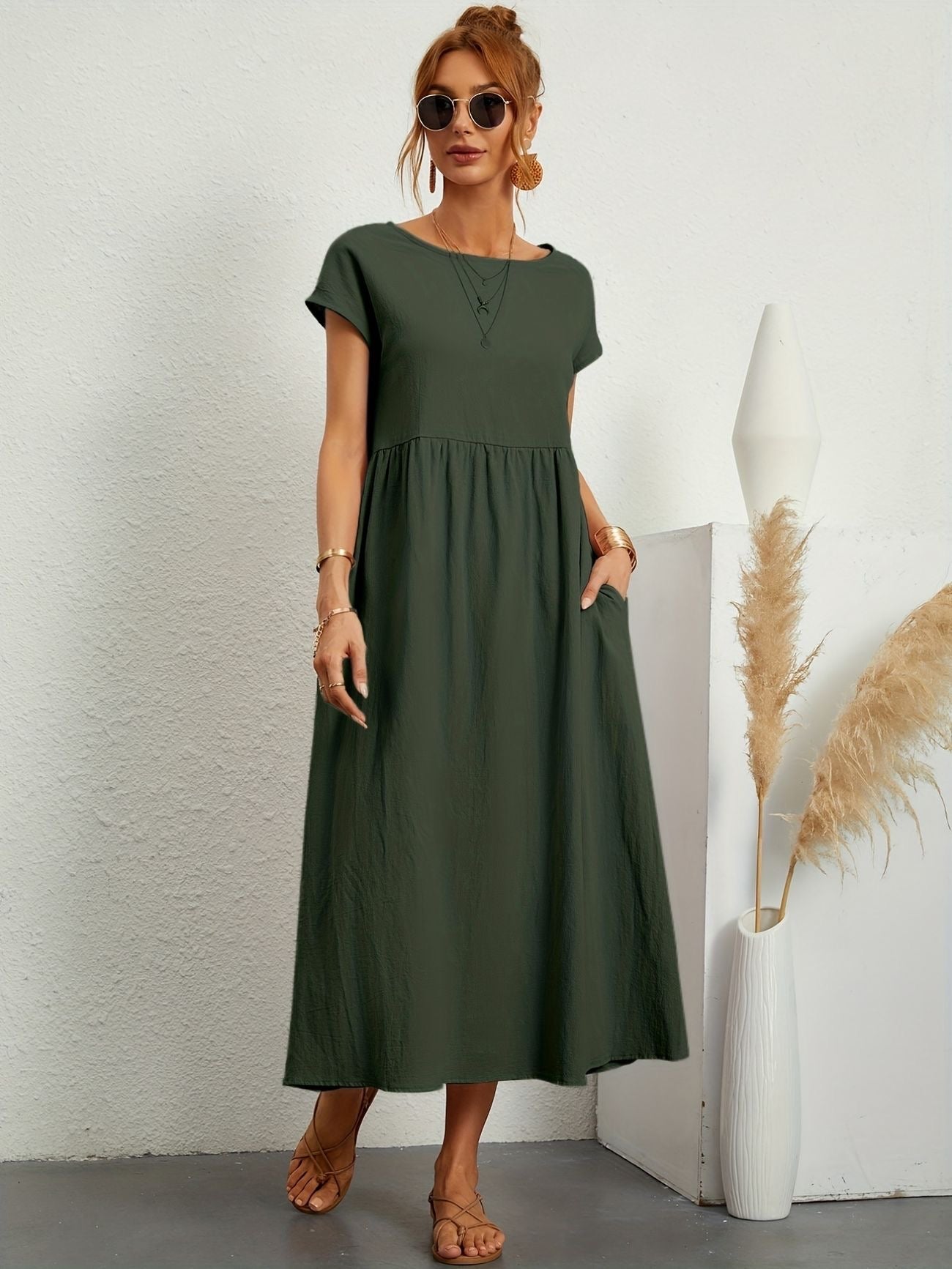 Dark green midi casual dress with short sleeves and gathered waist, loose flared skirt
