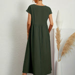 Dark green midi casual dress with short sleeves and gathered waist, back view