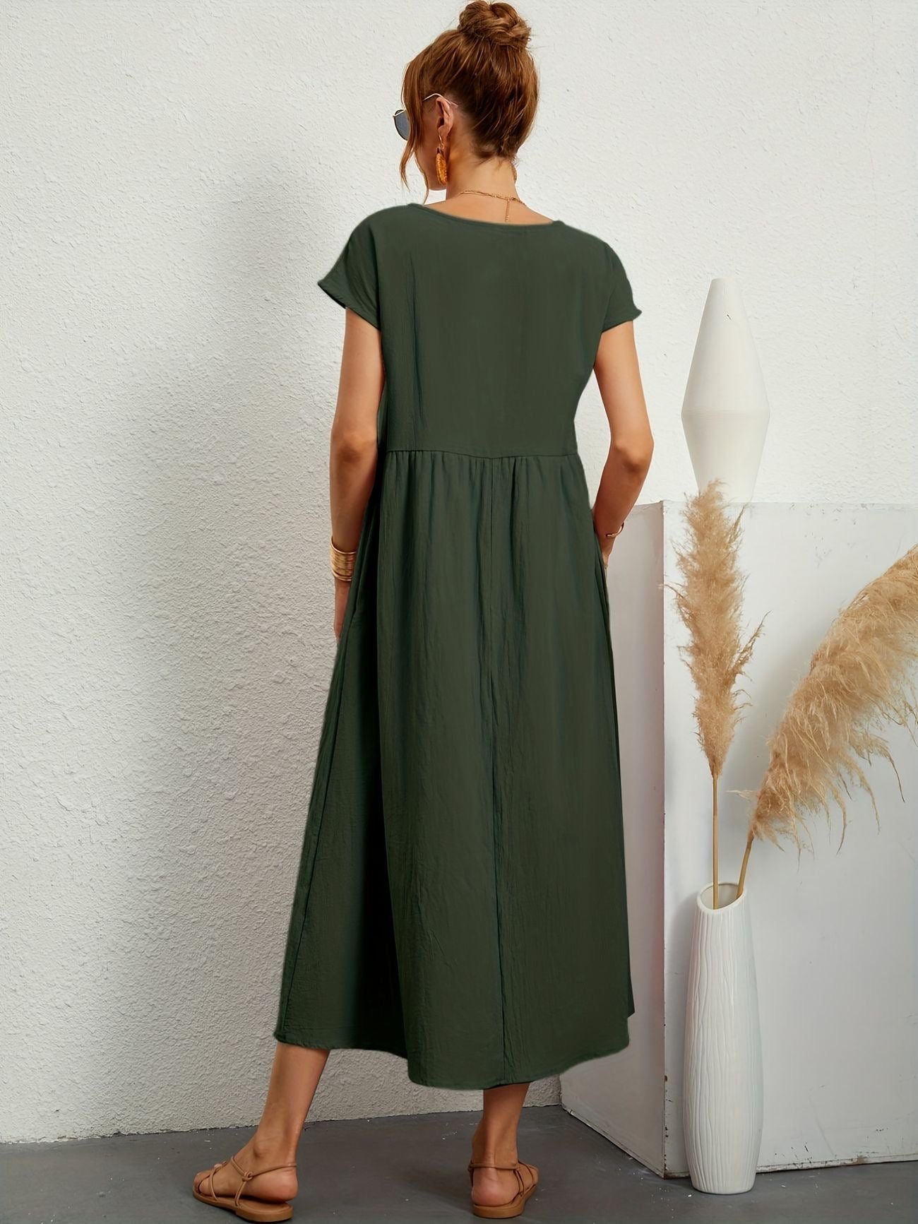 Dark green midi casual dress with short sleeves and gathered waist, back view