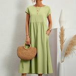 Light green midi casual dress with short sleeves and gathered waist, front view