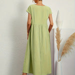 Light green midi casual dress with short sleeves and gathered waist, back view