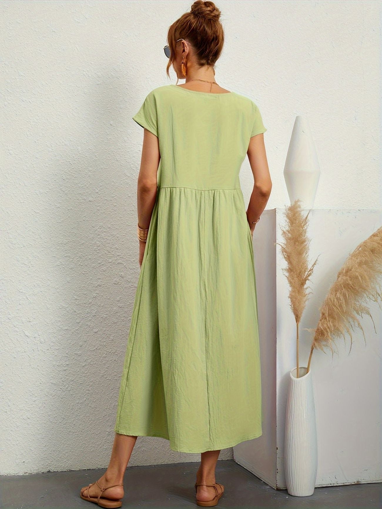 Light green midi casual dress with short sleeves and gathered waist, back view