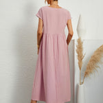 Pale pink midi casual dress with short sleeves and gathered waist, back view