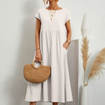 White midi casual dress with short sleeves and gathered waist, loose flared skirt