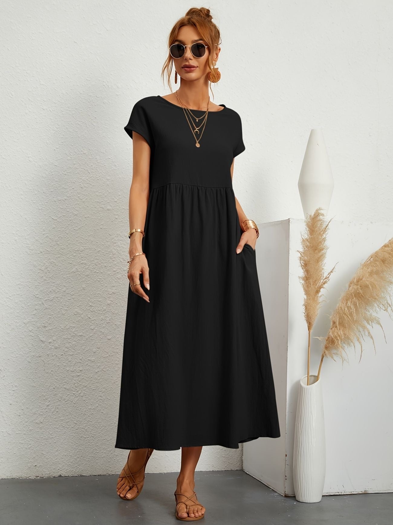 Black midi casual dress with short sleeves and gathered waist, loose flared skirt