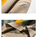 Beige crew pullover collar and hem closeup with ribbed knit trim