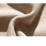 Beige crew pullover fabric closeup showing textured knit weave