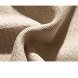 Beige crew pullover fabric closeup showing textured knit weave