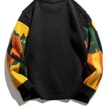 Black crew pullover with solid back and multicolor striped sleeves, ribbed hem