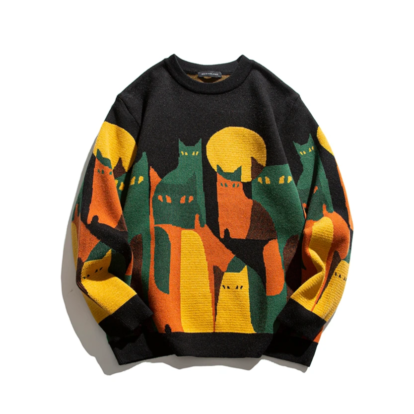 Black cat graphic crew pullover with multicolor city scene and ribbed cuffs