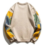 Beige crew pullover with solid back and multicolor striped sleeves, ribbed hem
