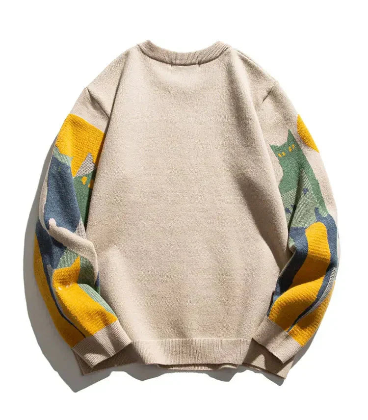 Beige crew pullover with solid back and multicolor striped sleeves, ribbed hem