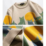 Beige cat crew pullover closeup: ribbed collar, striped cuffs, knit texture details