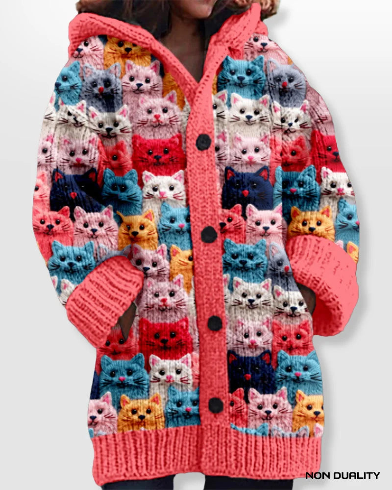 Knitted cat cardigan in bright red with allover cat print, button-front and ribbed cuffs.