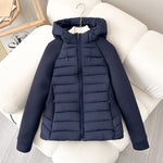Women’s light hybrid quilted jacket with hood, navy, zip-up front on chair