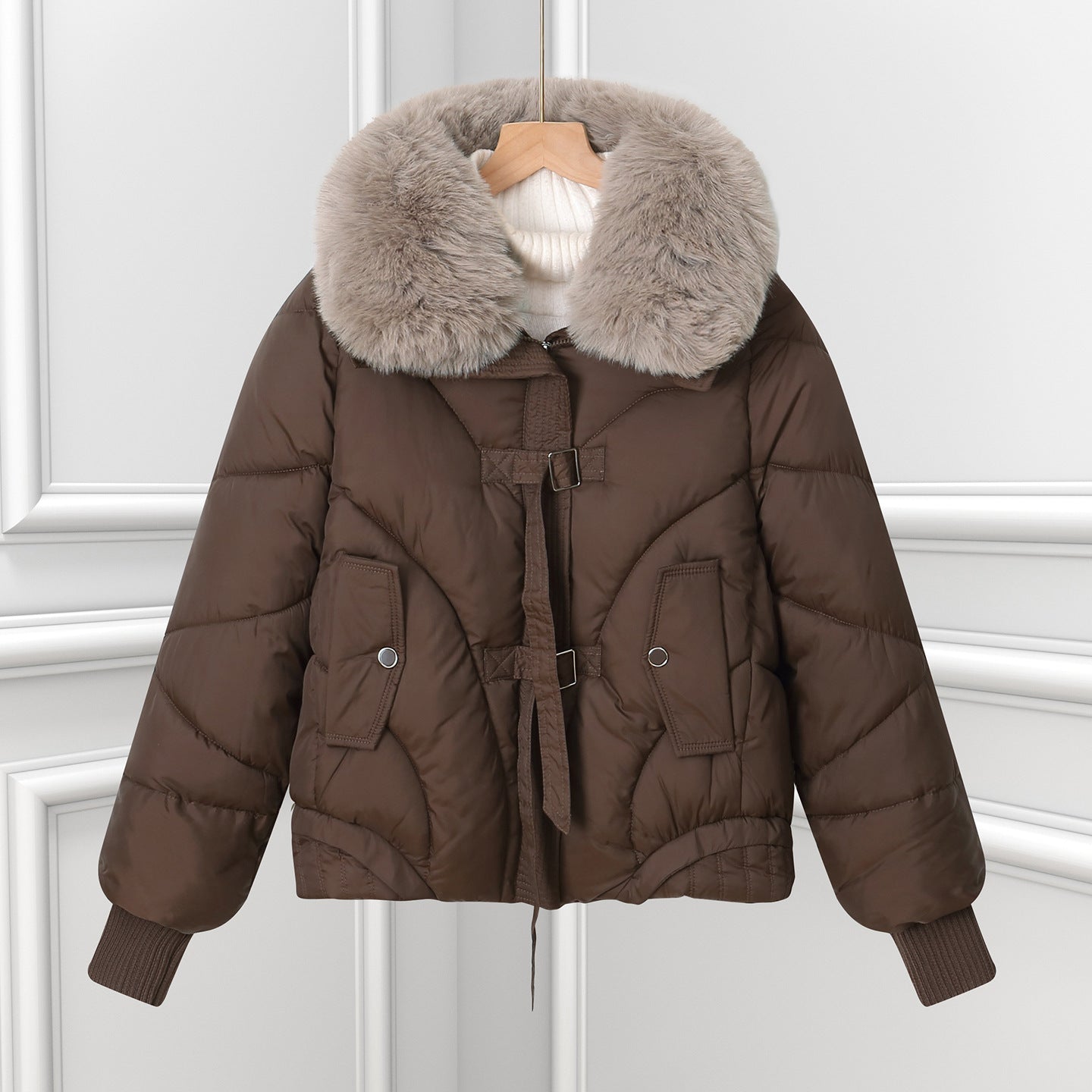 Brown short puffer pilot jacket with large faux fur collar and drawstring hem.