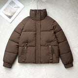 Brown short quilted puffer jacket with high stand collar, zip front, D-ring strap pockets