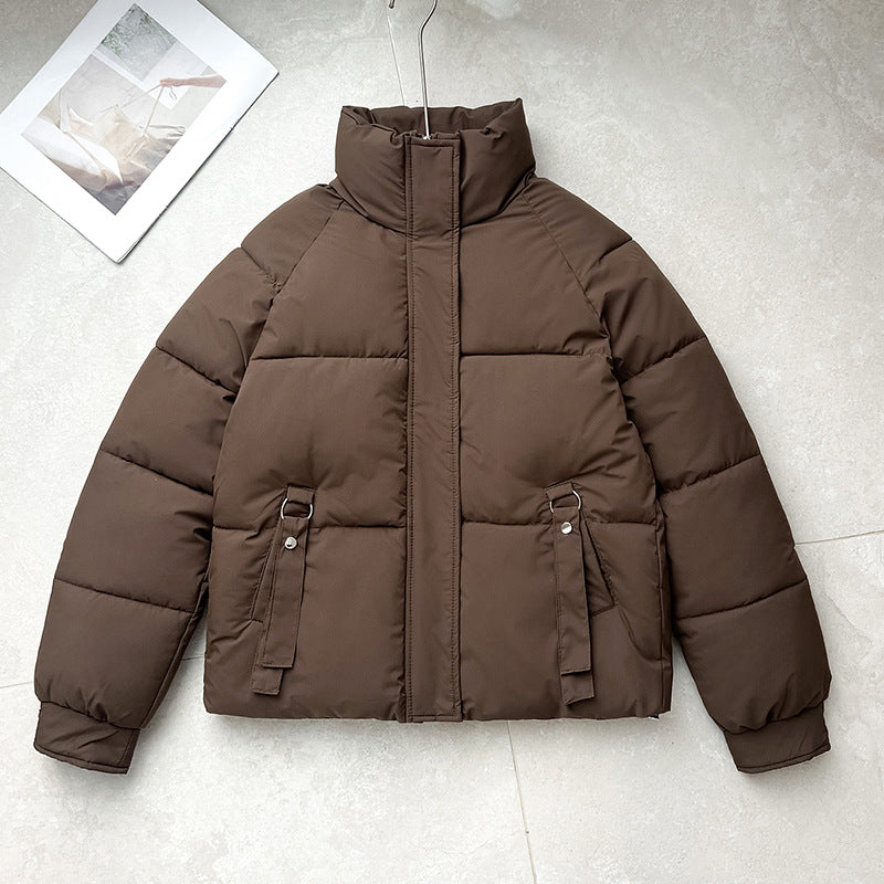 Brown short quilted puffer jacket with high stand collar, zip front, D-ring strap pockets