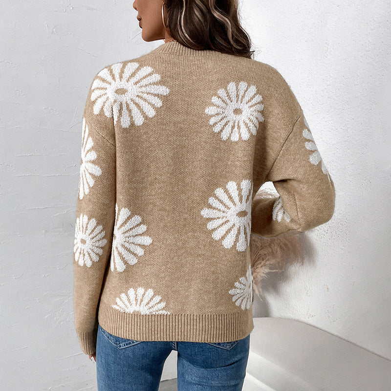 Women's khaki crewneck floral sweater with white daisy pattern, long sleeves (back view)