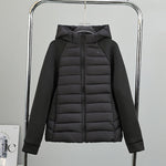 Women’s light hybrid quilted jacket with hood, black, zip-up front view on hanger