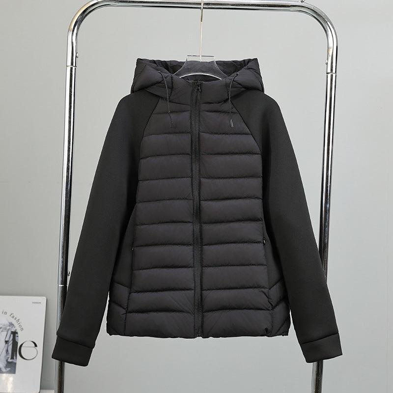 Women’s light hybrid quilted jacket with hood, black, zip-up front view on hanger