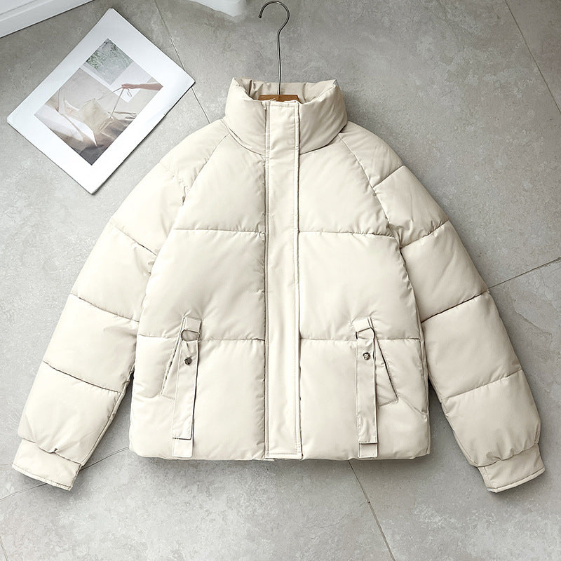 Cream short quilted puffer jacket with high stand collar, zip front, D-ring strap pockets